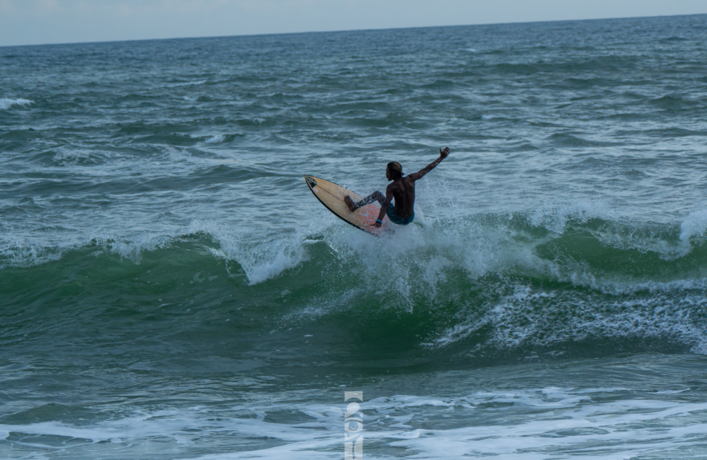 Noel Forseas, high-quality sports photographer Australia. A man succesfully jumping a wave.