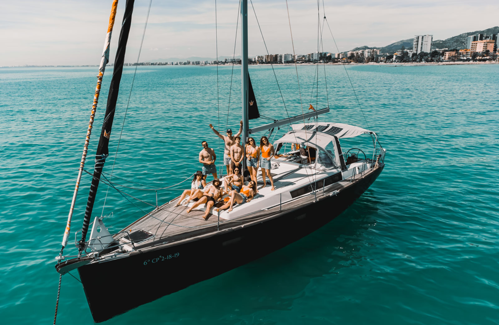 Noel Forseas, high-quality sports photographer Bali. People having a nice time on a boat.